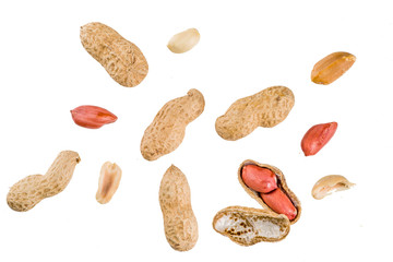 Whole and open peanut nuts isolated on a white background