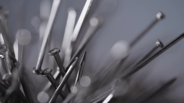 Metal nails under the influence of a magnetic field. Abstract background.
