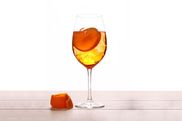aperol spritz cocktail with orange isolated on wood table