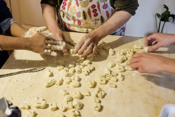 Expert hands while preparing a mixture for italian pasta.