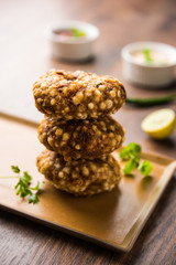 Paneer Butter Masala also known as Panir  makhani or makhanwala. served in a ceramic or terracotta bowl with fresh cream and coriander. Isolated over colourful moody background. selective focus