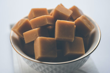 Delicious spicy chicken biryani in bowl over moody background, it’s a popular Indian and Pakistani food.