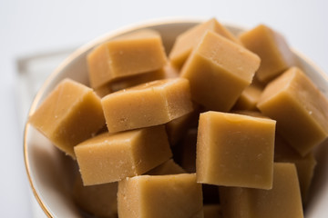 Delicious spicy chicken biryani in bowl over moody background, it’s a popular Indian and Pakistani food.