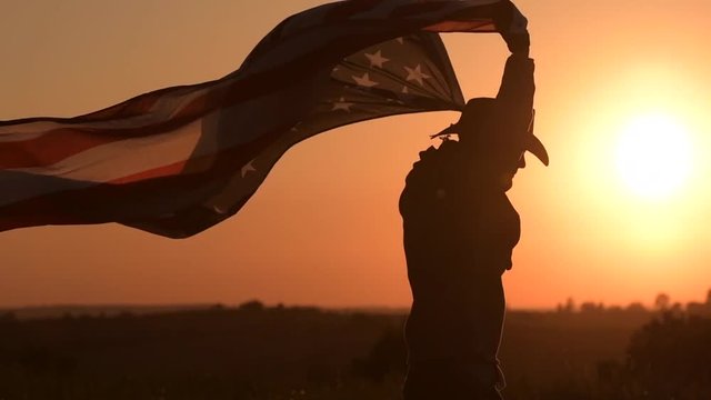 Independence Day Celebration. Western Wear Men in Cowboy Hat with United States of American Flag Celebrating 4th of July.