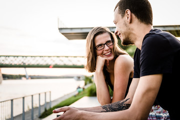 Cheerful couple having funny conversation