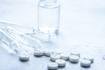 medicine set with pills and vials on doctor's workplace backgrou