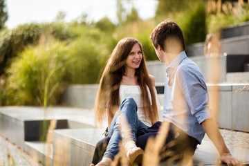Smiling teen woman gazing at her boyfriend