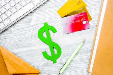 dollar sign and cards for fee-paying education on gray student d