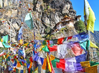 Colorful Buddhist prayer flags at Taktshang Goemba or Tiger's nest monastery in Paro, Bhutan
