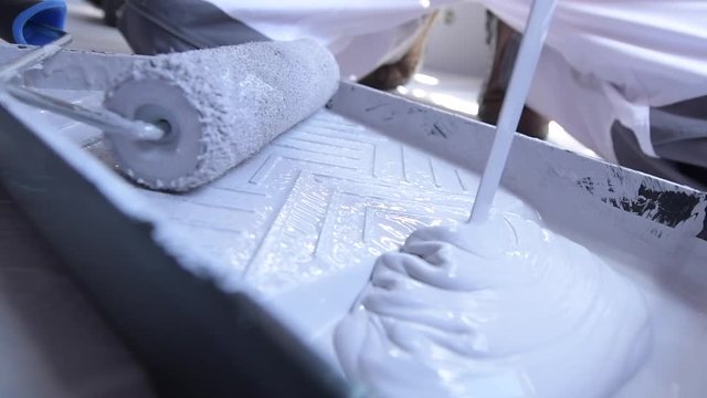 Praparing White Paint For the Room Painting. Slow Motion Footage