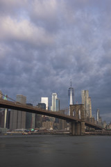 Amazing morning sky over Manhattan skyline and Brooklyn Bridge in New York City