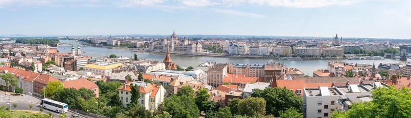 Fototapeta na wymiar Wide panorama overview of Budapest the capical of Hungary with Hungarian Parliament and Danube River. Budapest european cityscape.