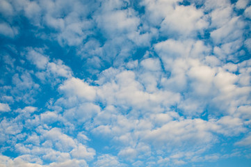 White fluffy clouds in deep blue sky