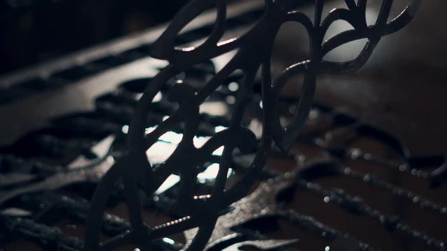 close up shot of a man's hands who holds an openwork metal piece obtained on a plasma machine by using a plasma jet to impart the desired shape to the product.