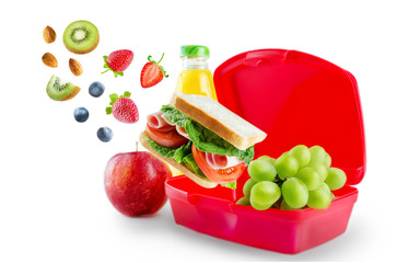 School lunch with flying sandwich, fresh fruits and juice