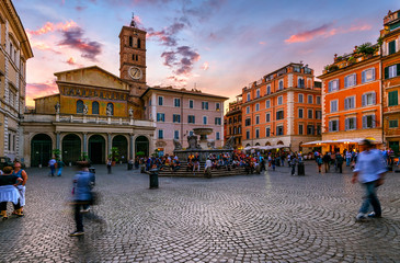 Basilica di Santa Maria in Trastevere and Piazza di Santa Maria in Trastevere at sunset, Rome, Italy. Trastevere is rione of Rome, on west bank of Tiber in Rome. Architecture and landmark of Rome