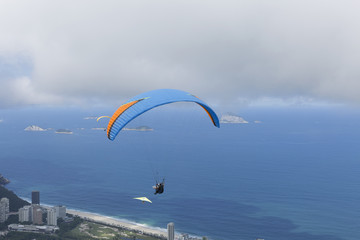 Paraglider flying over Sao Conrado in Rio de Janeiro.