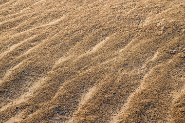 Sand of a beach with waves