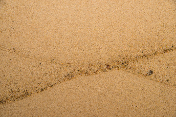 Sand of a beach with small pebbles