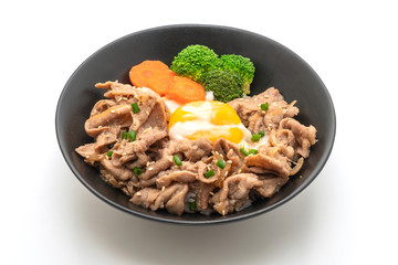 donburi, pork rice bowl with onsen egg and vegetable
