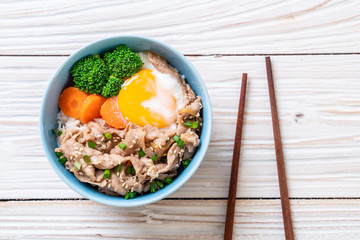 donburi, pork rice bowl with onsen egg and vegetable