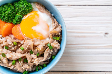 donburi, pork rice bowl with onsen egg and vegetable