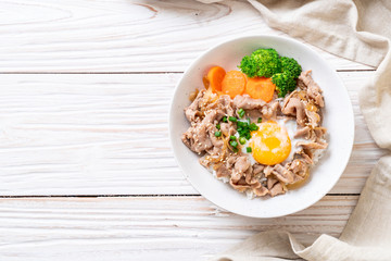 donburi, pork rice bowl with onsen egg and vegetable