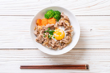 donburi, pork rice bowl with onsen egg and vegetable