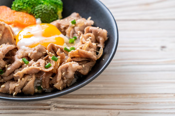 donburi, pork rice bowl with onsen egg and vegetable