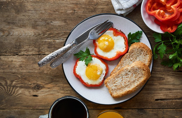 Fried eggs in pepper on a plate         