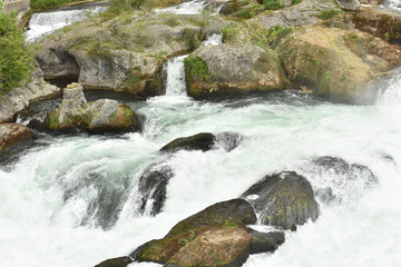 Naklejka na ściany i meble The Rhine Falls in Switzerland. A large stream of water.