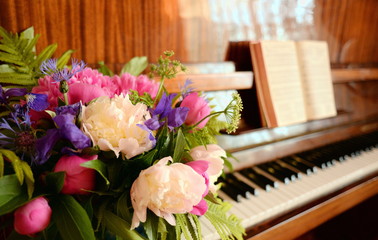 Peonies and fleur-de-lis in a vase