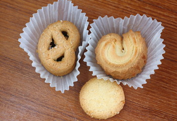 fresh sweet cookies on wooden in background