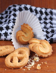 fresh sweet cookies on wooden in background