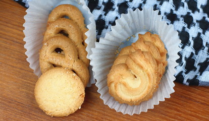 fresh sweet cookies on wooden in background