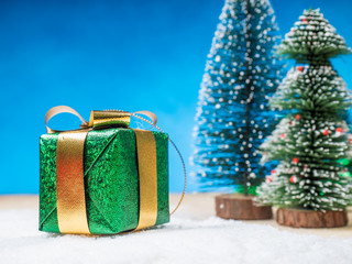 Fototapeta na wymiar beautiful gift box on snow floor, christmas background concept