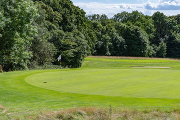 Green With Flag On A Golf Course