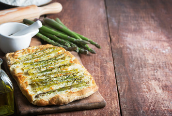 Asparagus green pizza with herbs and mozzarella. Copy space