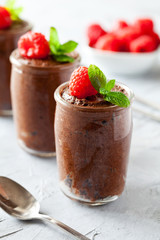 Glasses Of Homemade Dark Chocolate Mousse With Raspberries