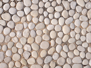 Paving from sea pebbles. Background, texture