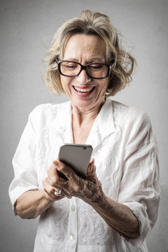 Happy lady using a smartphone