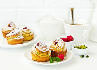 puff pastry with pistachios and raspberries.