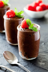 Small Pots Of Dark Chocolate Mousse With Raspberries