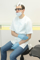 Dentist suffering from elbow pain -occupational disease