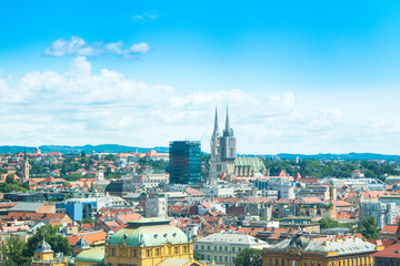 Fototapeta na wymiar Panoramic view on rooftops in Zagreb center and catholic cathedral, urban city landscape, Croatia 