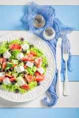 Healthy Greek salad with cherry tomatoes, lettuce and feta cheese