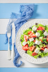 Diet Greek salad with lettuce, cherry tomatoes and onion