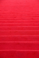 Red carpet covered stairs perspective