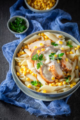 Delicious pasta with bechamel sauce, chicken and corn