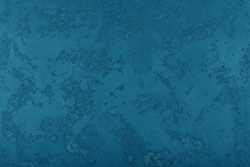 Grunge blue painted plaster wall background